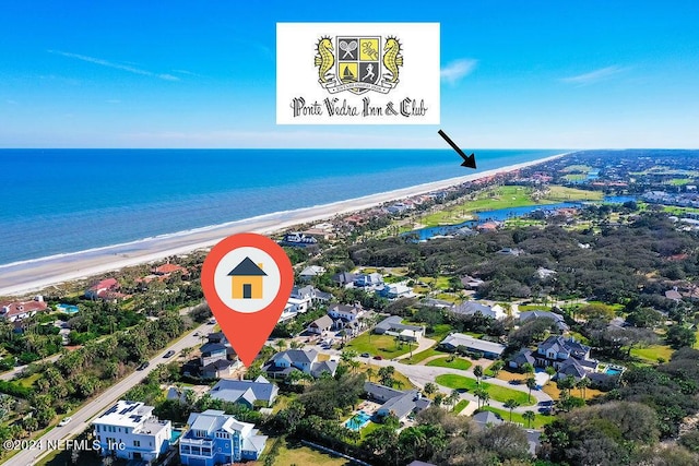 aerial view featuring a view of the beach and a water view