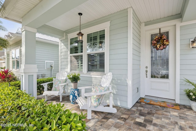 doorway to property with covered porch