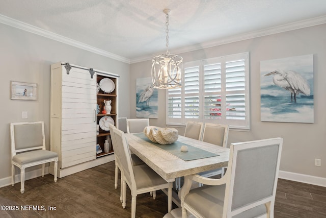 dining area featuring dark wood-type flooring, ornamental molding, and a notable chandelier