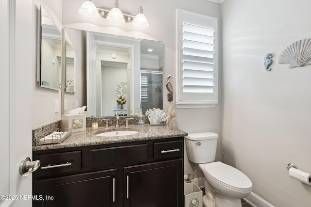 bathroom with vanity, toilet, and an enclosed shower