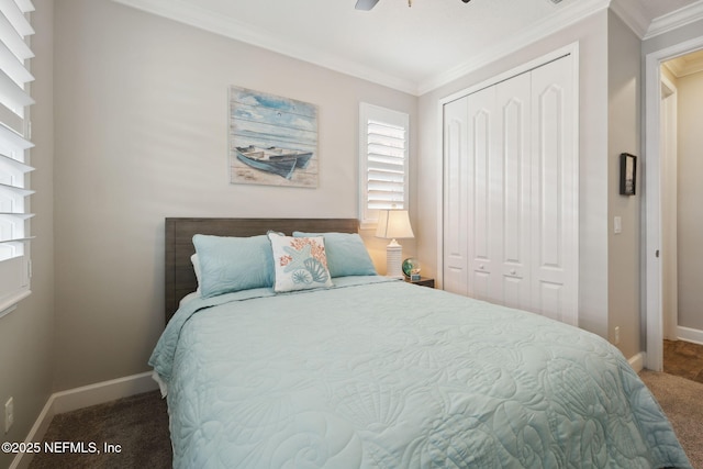 carpeted bedroom featuring crown molding, ceiling fan, and a closet