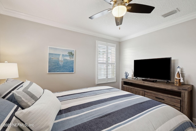 bedroom with ornamental molding and ceiling fan