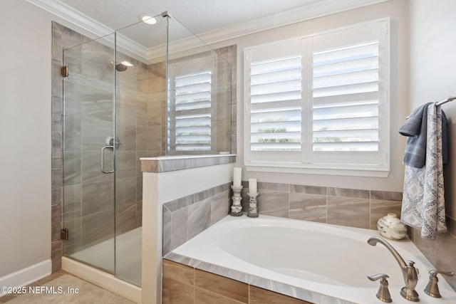 bathroom with ornamental molding and plus walk in shower