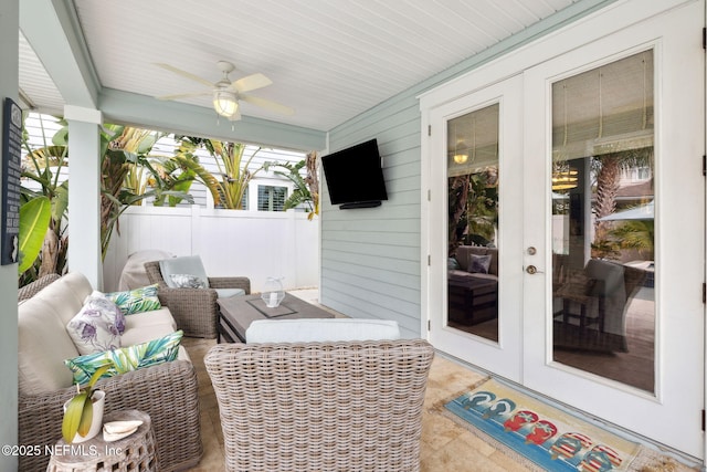 sunroom featuring french doors and ceiling fan