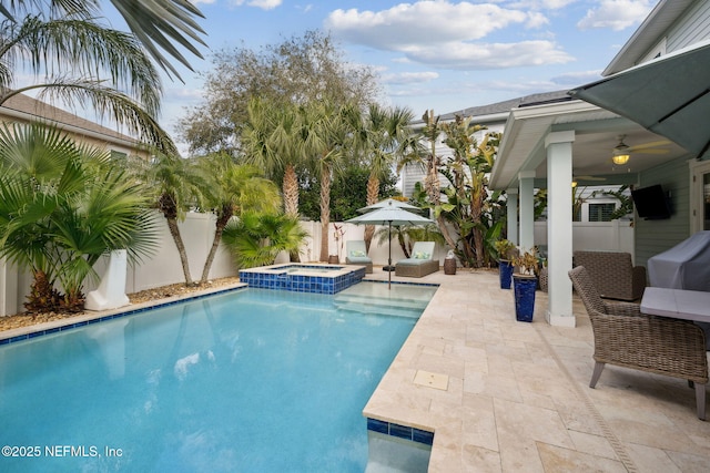 view of pool featuring an in ground hot tub, grilling area, outdoor lounge area, and a patio