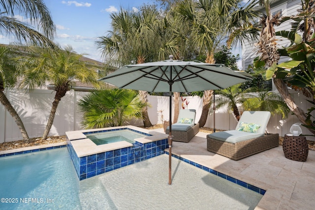 view of pool featuring an in ground hot tub and a patio