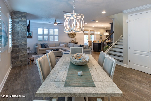 dining area with wood walls, dark hardwood / wood-style floors, and a wealth of natural light