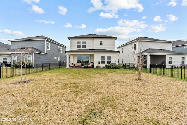 rear view of house featuring a yard, outdoor lounge area, and a fenced backyard