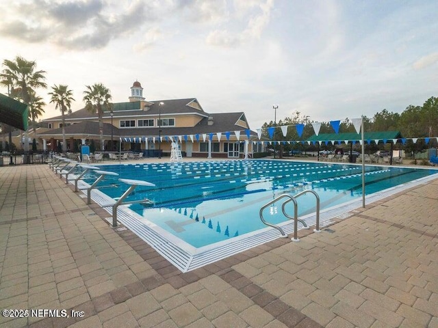 view of pool featuring a patio