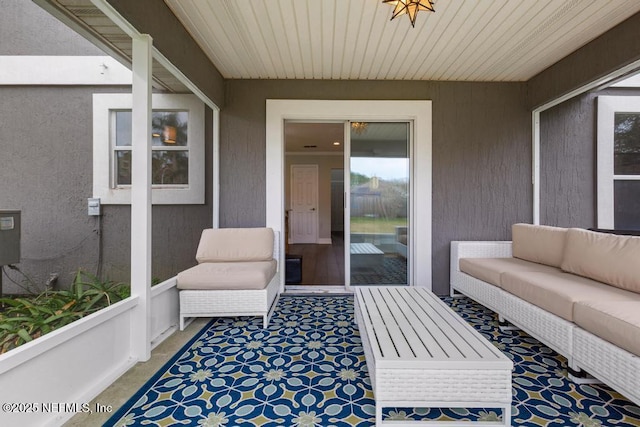 sunroom featuring wooden ceiling
