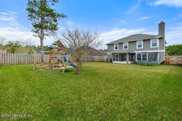 view of yard with a playground and a sunroom