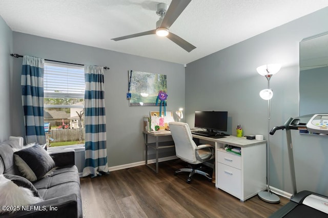 home office with dark wood-type flooring and ceiling fan