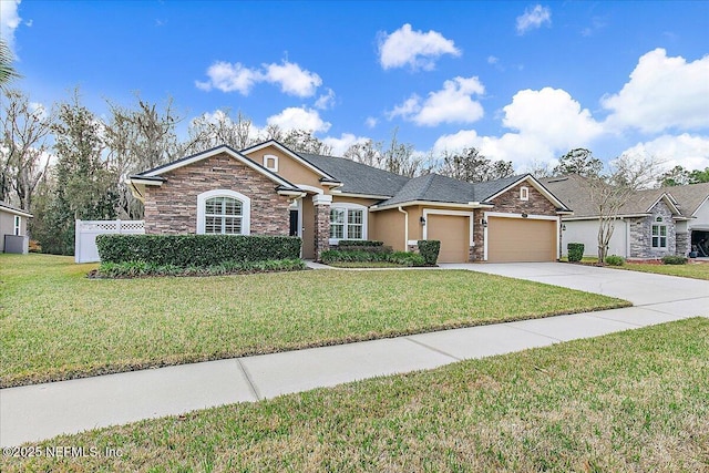 view of front facade with a garage and a front yard