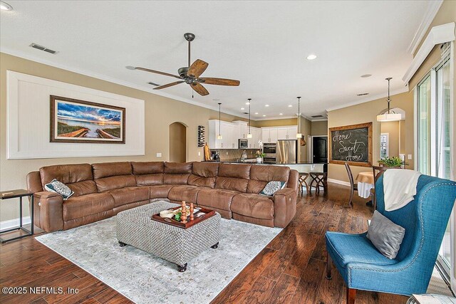 721 W Kings College Dr, Saint Johns, FL 32259 - living room with crown molding, dark wood-type flooring, and ceiling fan