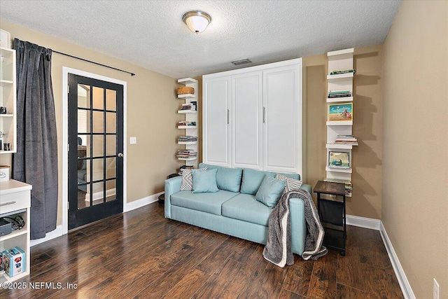 721 W Kings College Dr, Saint Johns, FL 32259 - living area with dark wood-type flooring and a textured ceiling