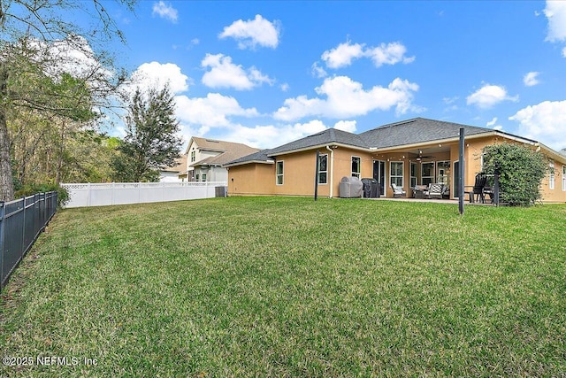 721 W Kings College Dr, Saint Johns, FL 32259 - back of property featuring ceiling fan, a yard, and a patio area