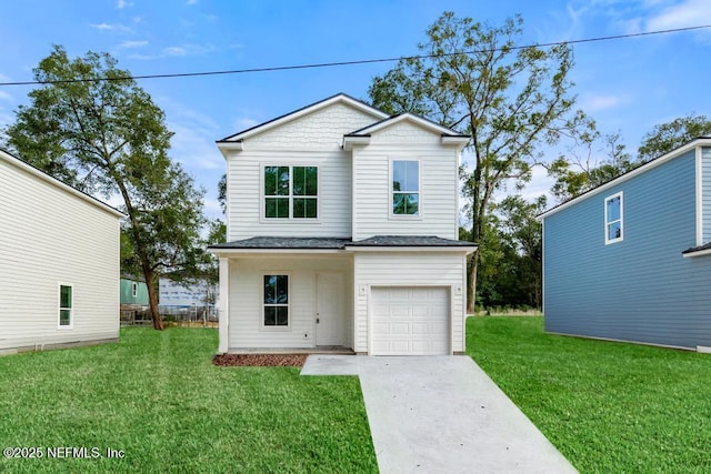 view of property with a garage and a front yard