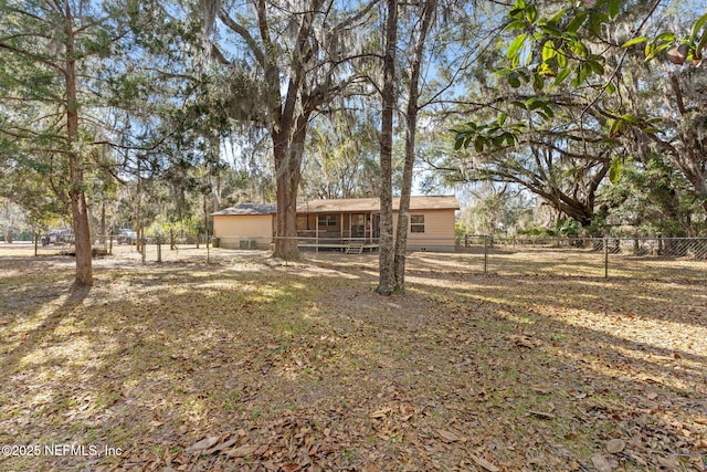 rear view of property featuring crawl space and a fenced backyard