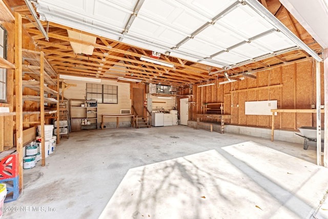 garage featuring washing machine and clothes dryer