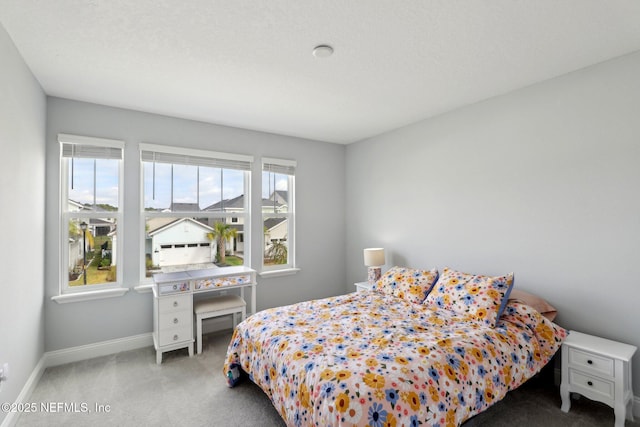 carpeted bedroom with baseboards