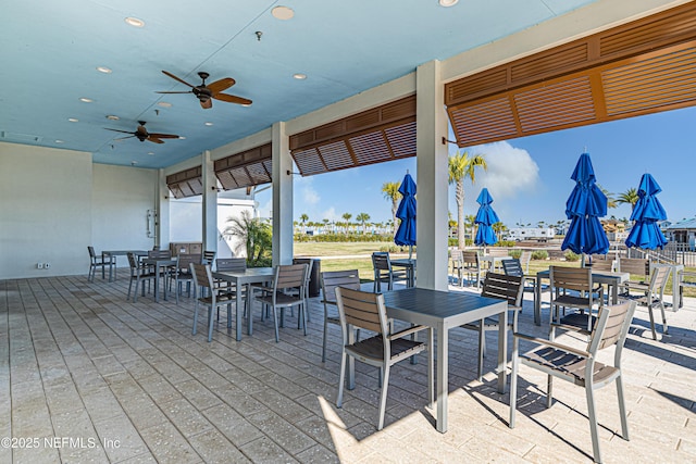 view of patio / terrace featuring a ceiling fan, outdoor dining space, and visible vents