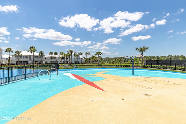 view of pool with fence