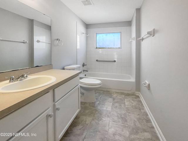 full bathroom with vanity, toilet, and tiled shower / bath combo