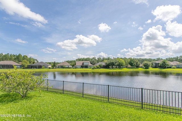 water view with a residential view and fence