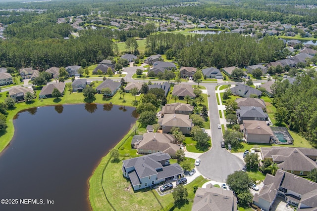 aerial view featuring a residential view and a water view