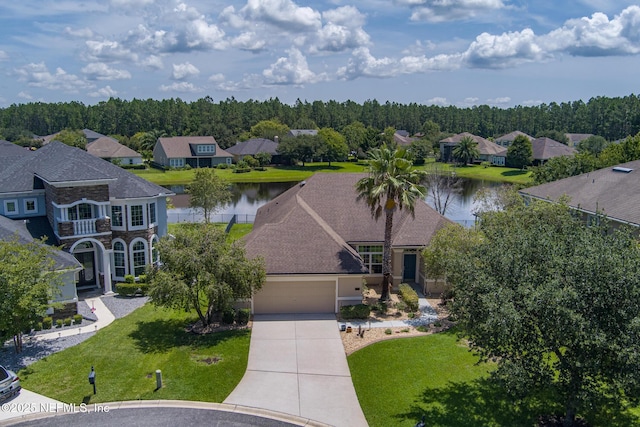 drone / aerial view with a water view and a residential view