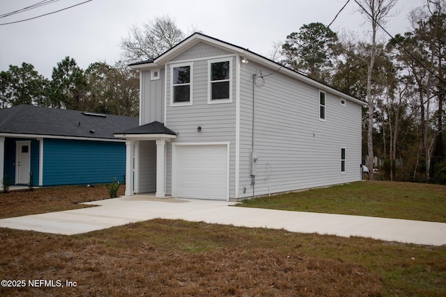 front facade with a garage and a front lawn