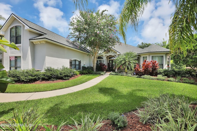 view of front of home with a front lawn