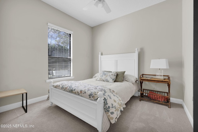 bedroom with light colored carpet and ceiling fan