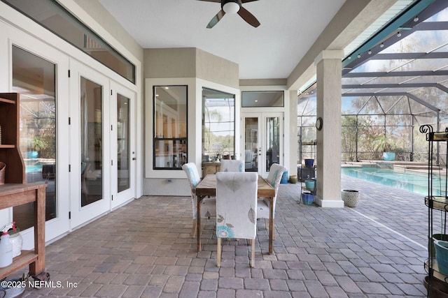 view of patio featuring ceiling fan and french doors