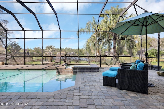 view of swimming pool with an in ground hot tub, a patio area, and glass enclosure