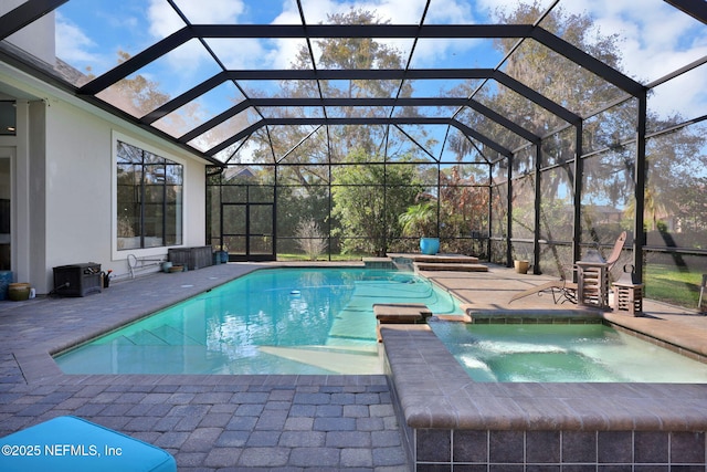 view of swimming pool featuring an in ground hot tub, a lanai, and a patio