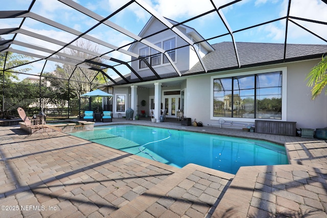 view of swimming pool with french doors, a lanai, an in ground hot tub, ceiling fan, and a patio