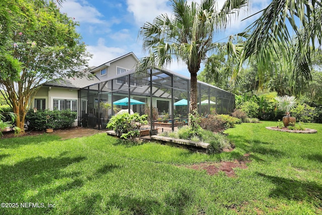 view of yard featuring glass enclosure