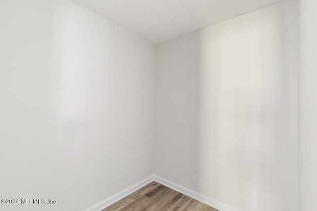 unfurnished room featuring wood-type flooring