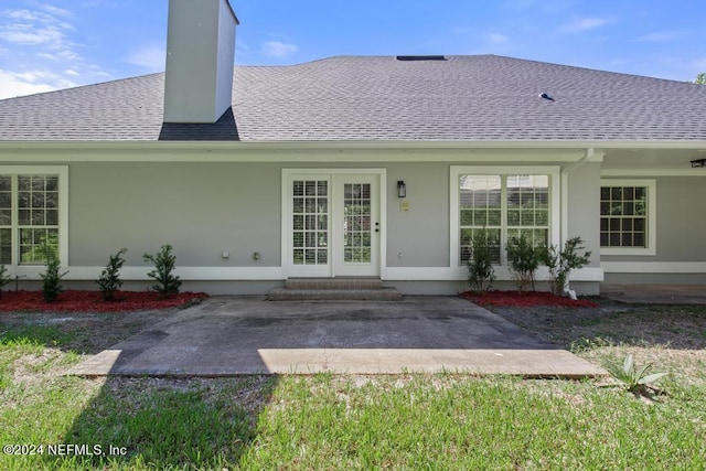 back of house with a patio area