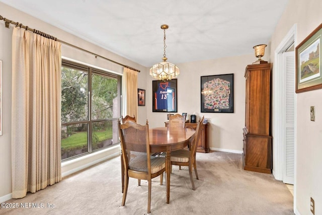 10154 Leisure Ln N Unit 22, Jacksonville, FL 32256 - dining room featuring light carpet and a notable chandelier