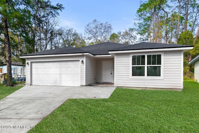 ranch-style home featuring a garage and a front yard