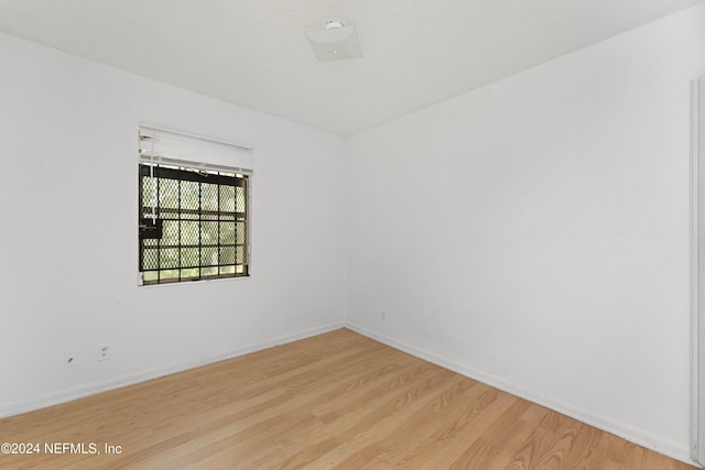 empty room with light hardwood / wood-style floors