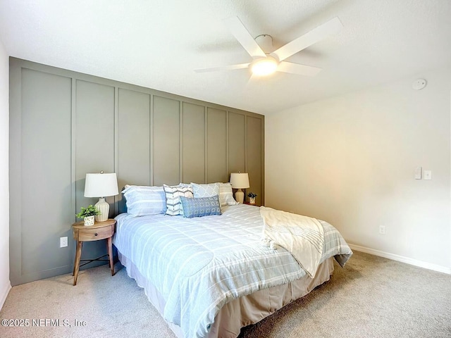 bedroom with ceiling fan and light colored carpet