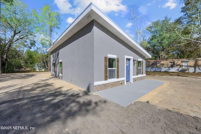 back of house with a patio