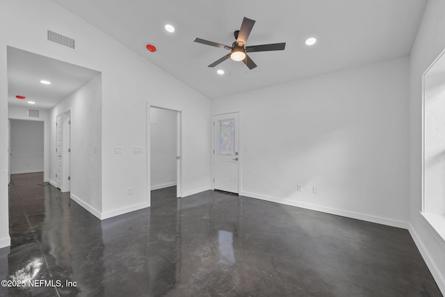 unfurnished room featuring lofted ceiling and ceiling fan