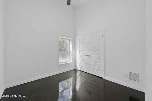 empty room featuring a high ceiling