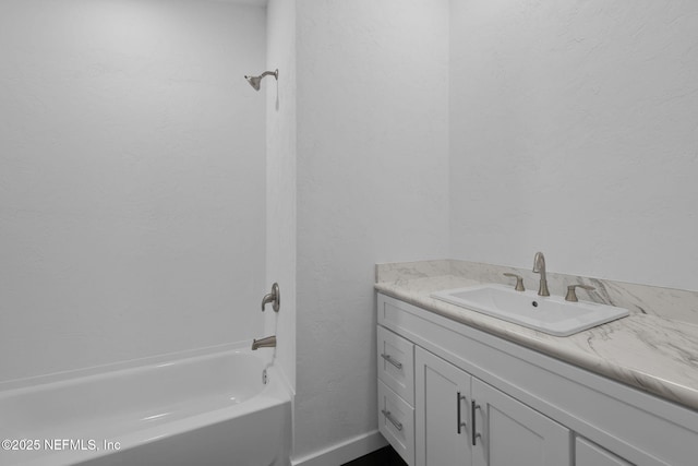 bathroom with vanity and washtub / shower combination