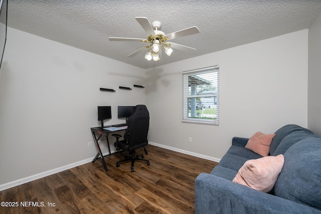 office area featuring ceiling fan, dark hardwood / wood-style floors, and a textured ceiling