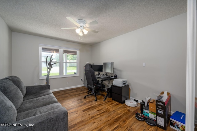 office featuring ceiling fan, dark hardwood / wood-style floors, and a textured ceiling